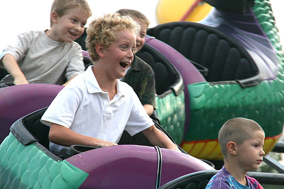 Children enjoying a carnival ride
